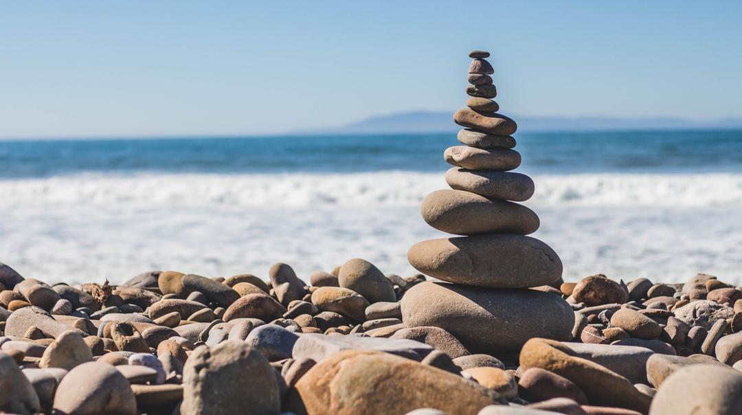 Beach with piled rocks image